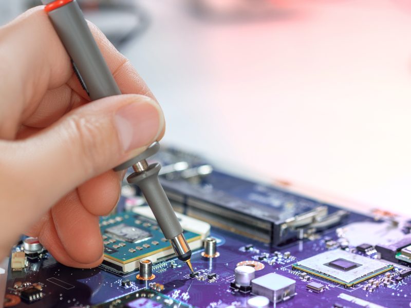 Electronics,Repair,Service,,Hand,Of,Female,Tech,Fixes,An,Electronic